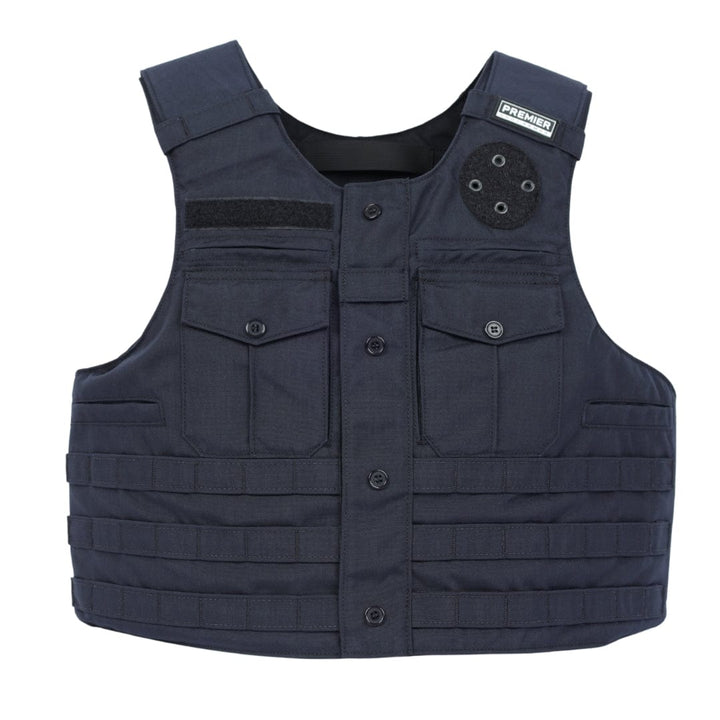 The Patrol Golf vest by Premier Body Armor features a dark blue color, front pockets, button closures, and horizontal webbing for attachments. A small "Premier" patch on the upper right shoulder adds practical style for law enforcement use.