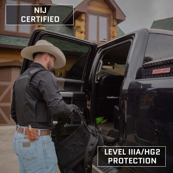 A man wearing a cowboy hat and a black Concealable Armor Vest - Level IIIA from Premier Body Armor places a bag into the back seat of a black truck outside a wooden building. Text on the image reads "NIJ Certified Level IIIA" at the top and "Made in the USA." at the bottom.