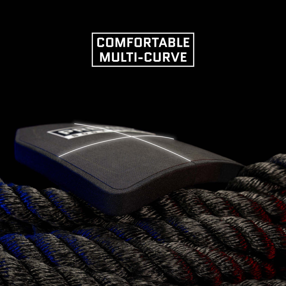 The Premier Body Armor Fortis Level III+ Loadout, featuring black protective gear with a multi-curve design, is placed on top of coiled ropes. The text "Comfortable Multi-Curve" is displayed above the gear against a solid black background.