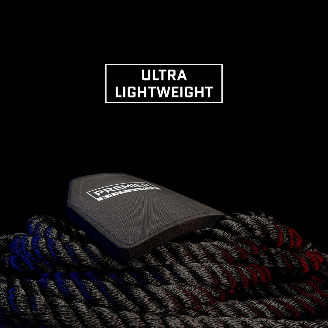 The image features a close-up of a Premier Body Armor Fortis III+/RF1 Single-Curve knee pad resting on a coiled black rope. The background is black, and there is a white rectangular text box above the pad with the words "Ultra Lightweight" in white capital letters, highlighting its impressive lightweight design similar to Level III plate ballistic protection.