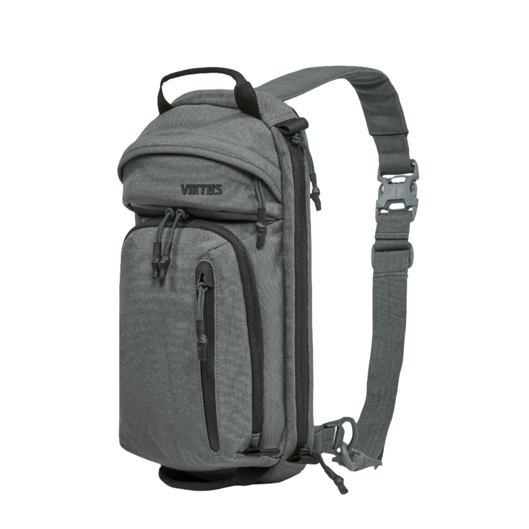 A compact, grey Viktos Upscale3 Sling with multiple zippered compartments. The bag features an adjustable single shoulder strap with a buckle for easy fastening. Perfect for concealed carry, the brand name "Viktos" is visible on the largest compartment.