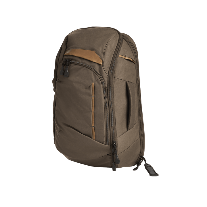 The Vertx Gamut 22L Sling by Vertx is a brown backpack with black zippers, a tan accent, and multiple compartments, including a dedicated CCW compartment, shown standing upright on a plain white background.