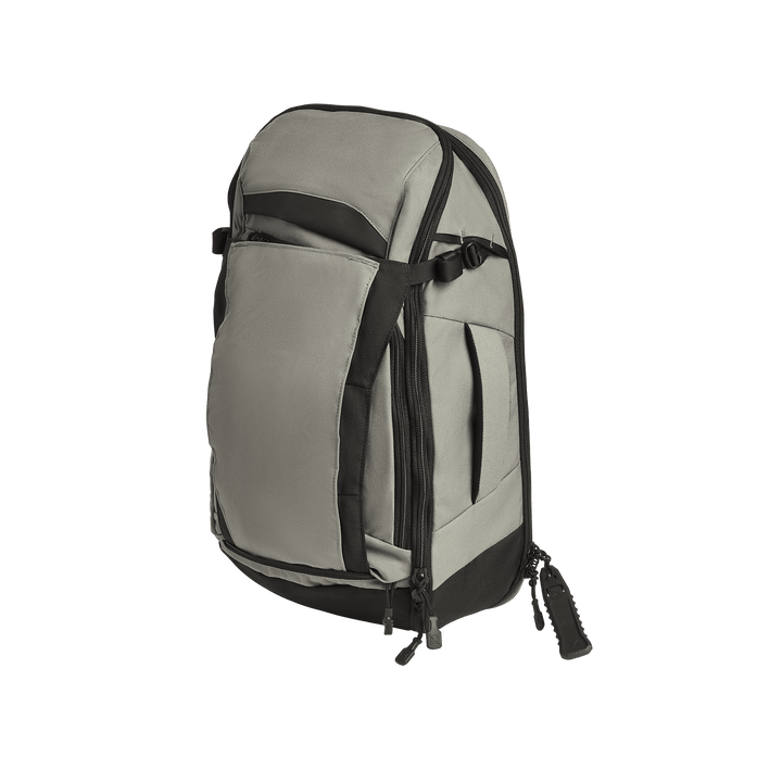 The Vertx Gamut 22L Sling backpack by Vertx features a gray and black design, multiple zippered compartments including a CCW section, adjustable side straps, and a top handle, displayed on a plain white background.