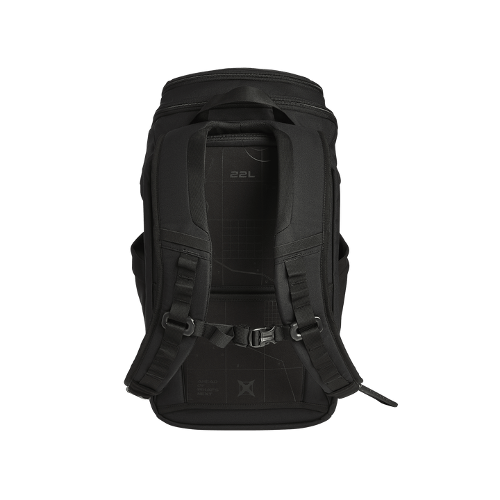 The Vertx Gamut 22L Pack by Vertx is shown upright with shoulder straps facing forward, featuring a grid back panel labeled "22L," multiple straps, buckles, and a rapid access CCW compartment, highlighting its durability.