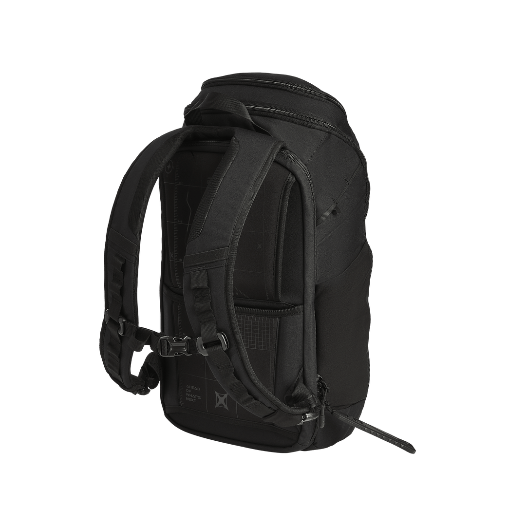 The Vertx Gamut 22L Pack by Vertx is shown from the back, highlighting its padded shoulder straps, ventilated back panel, side pocket, and rapid-access CCW compartment, all set against a plain white background.