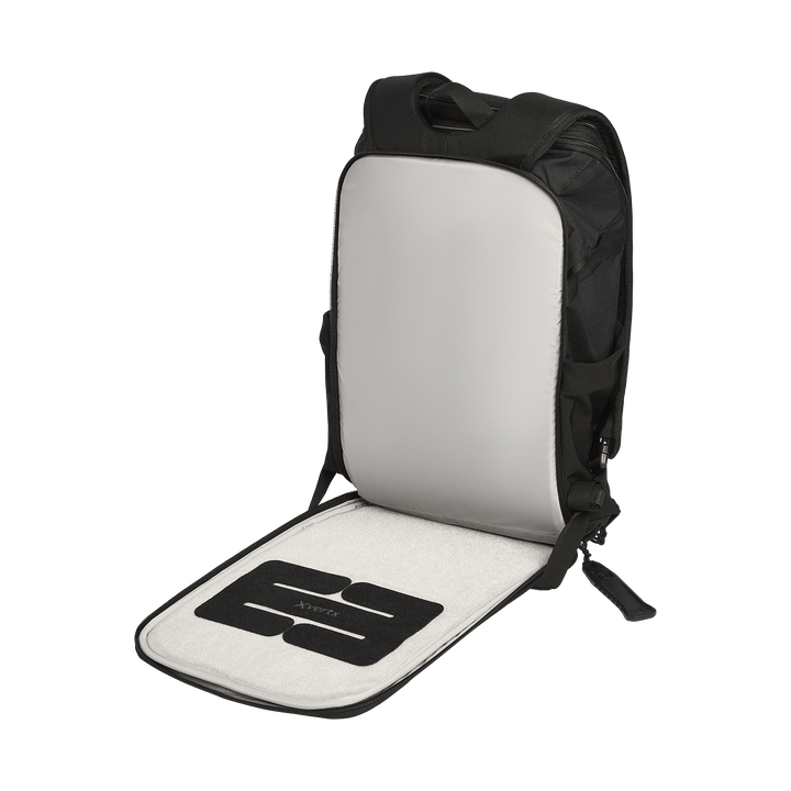 The Vertx Gamut 22L Pack by Vertx stands upright with its main compartment unzipped, revealing a light gray padded interior, a black-and-gray flat divider, and rapid-access organization for daily essentials.