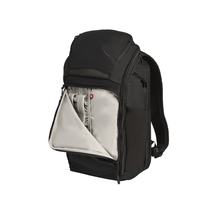 The Vertx Gamut 22L Pack by Vertx is a black EDC backpack shown upright against a white background, with its front compartment unzipped to reveal a light gray interior featuring multiple pockets and organizers for quick access.