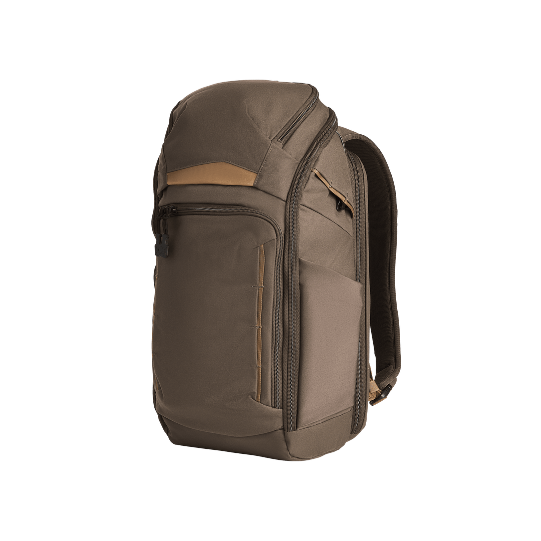 The Vertx Gamut 22L Pack in Cedar Brown, featuring multiple zippered compartments—including a rapid-access CCW pocket—a top handle, and adjustable shoulder straps, is shown against a plain white background.