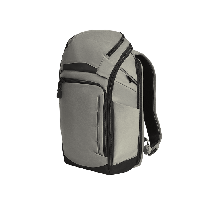 The Vertx Gamut 22L Pack by Vertx in Slate Grey/Black features multiple zippered compartments, rapid access features, and padded shoulder straps in a sleek, modern design, displayed against a plain white background.