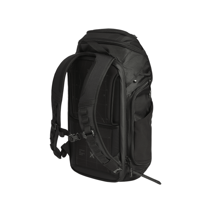 The Vertx Gamut 32L Pack by Vertx is a black travel backpack shown at a three-quarter angle with padded shoulder straps, sternum strap, multiple zippered compartments, and a dedicated CCW compartment on a plain white background.