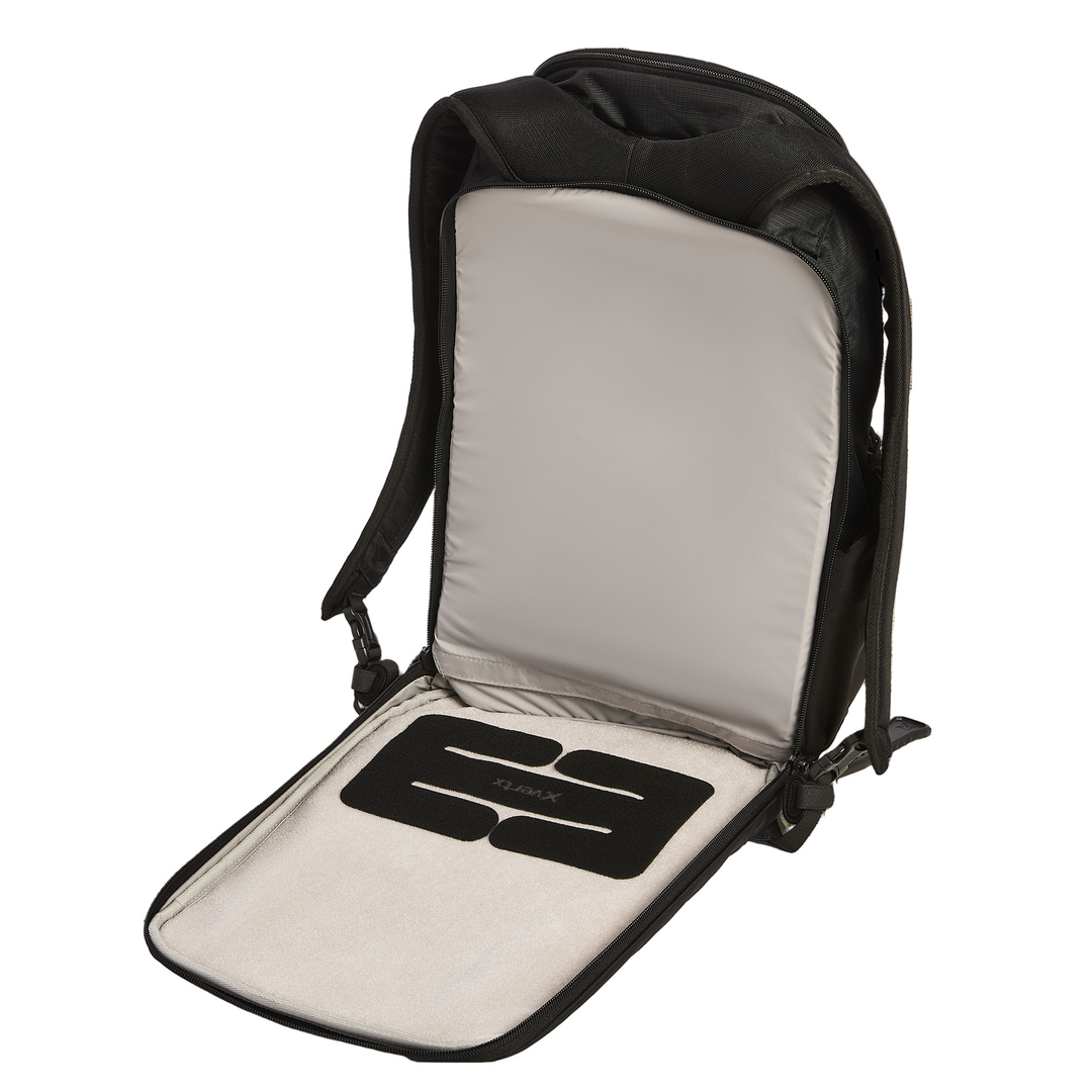 The Vertx Ready Pack X by Vertx is shown open and flat, revealing a padded compartment, a CCW compartment, and a removable black foam insert on its light inner lining.