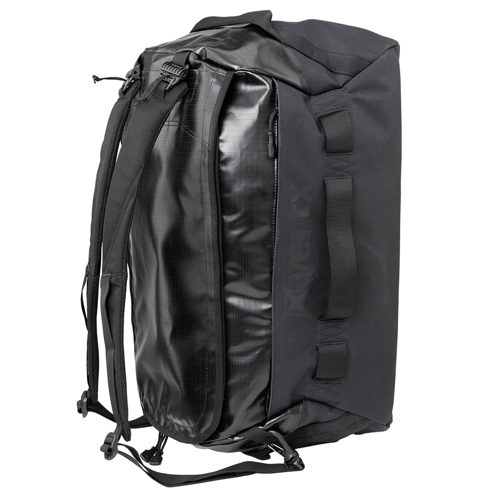 The Vertx RLT Duffel by Vertx boasts a robust build with various handles and adjustable shoulder straps. Its elegant design, highlighted by a glossy front panel, provides customizable storage options while ensuring ample interior space.