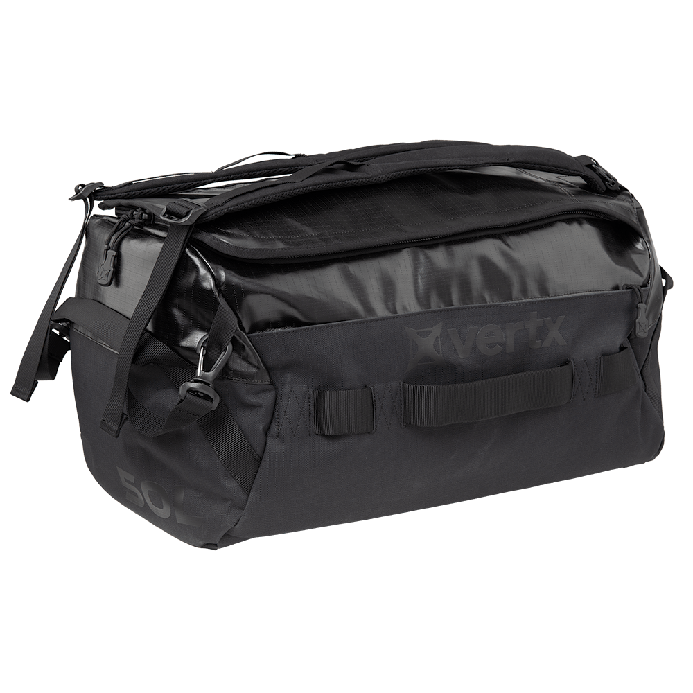 The Vertx RLT Duffel bag, displayed against a white background, offers robust construction with various compartments, strong handles, and an adjustable shoulder strap. It comes with reinforced material, subtle branding, and customizable storage options for optimal convenience.