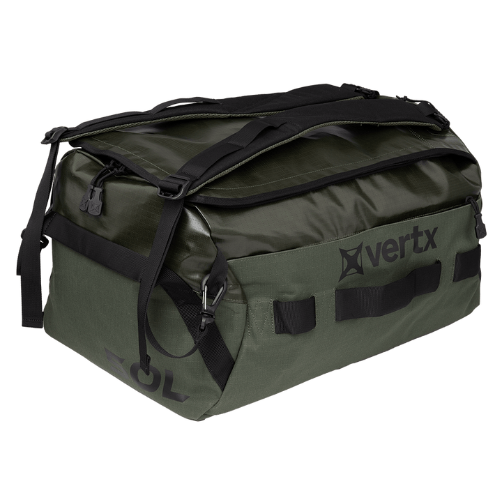 The Vertx RLT Duffel, a distinctive green and black bag displaying the "Vertx" logo on the side, features robust construction with adaptable storage options. Its tough design is enhanced by smooth black straps, zippers, and handles.