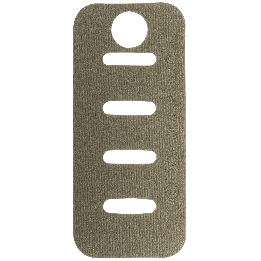 A rectangular, tan-colored Molle Adaptor Panel - Single with rounded corners, featuring four horizontal slits in the middle and a circular hole near the top. The text on the right side reads "INVICTA MADE SIMPLE." This Vertx product's MOLLE-compatible design and Tactigami integration ensure versatile use. The background is a solid green color.