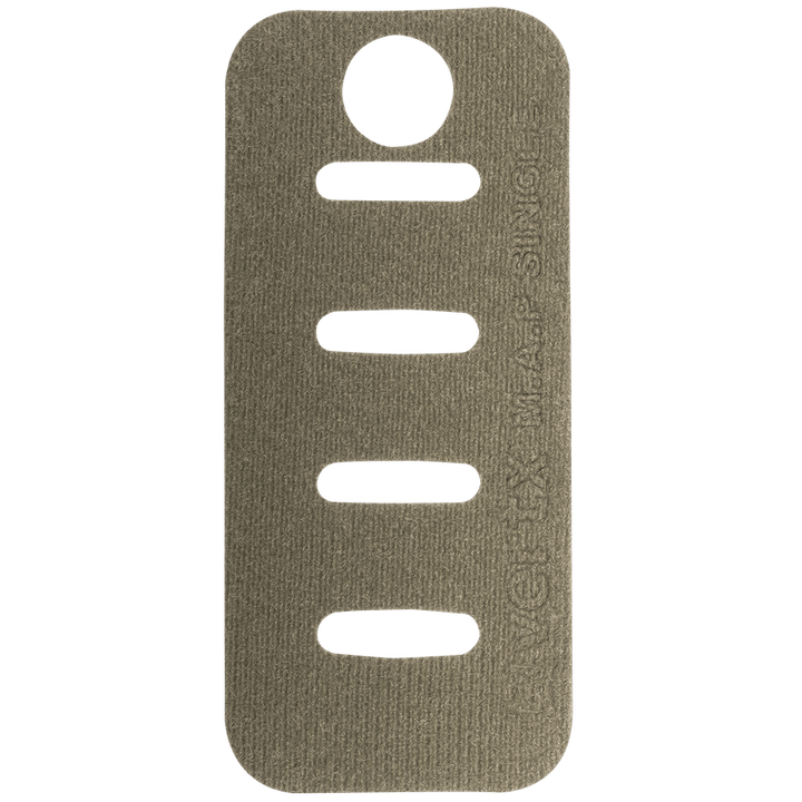 A rectangular, tan-colored Molle Adaptor Panel - Single with rounded corners, featuring four horizontal slits in the middle and a circular hole near the top. The text on the right side reads "INVICTA MADE SIMPLE." This Vertx product's MOLLE-compatible design and Tactigami integration ensure versatile use. The background is a solid green color.