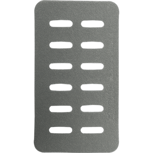 Rectangular, gray metallic object with seven parallel horizontal slots, evenly spaced, occupying the center. The surface appears textured. Lines of small text and symbols are faintly visible on the right side—resembling a Vertx Molle Adaptor Panel - Double.