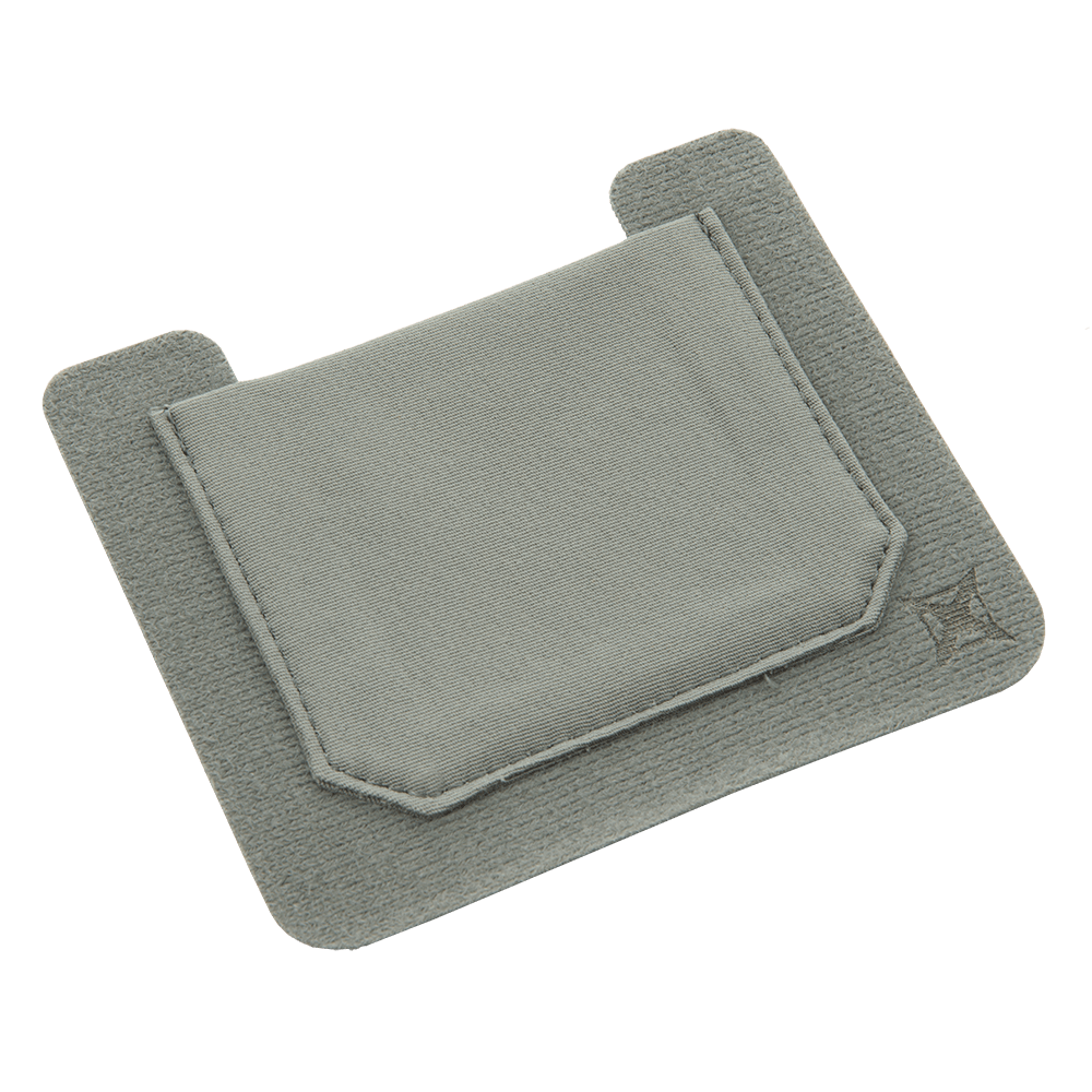 The Vertx Stretch Pocket Small 2 pack by Vertx is a light grey fabric sleeve with a convenient pocket design perfect for organizing your kit. This product offers a simple, clean appearance and features two extended flaps at the top secured with VELCRO Brand ONE-WRAP. An embroidered star pattern decorates the lower right corner, adding a touch of style to the transparent background.