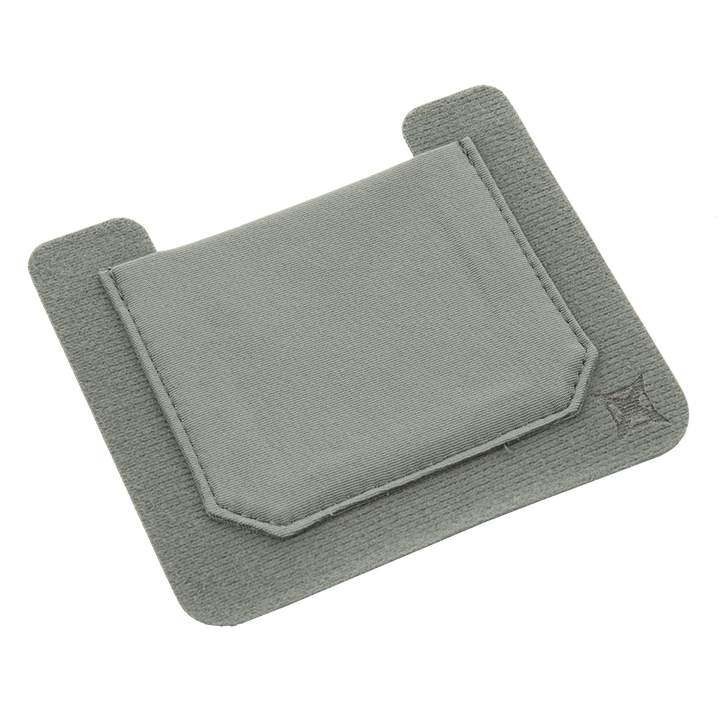 The Vertx Stretch Pocket Small 2 pack by Vertx is a light grey fabric sleeve with a convenient pocket design perfect for organizing your kit. This product offers a simple, clean appearance and features two extended flaps at the top secured with VELCRO Brand ONE-WRAP. An embroidered star pattern decorates the lower right corner, adding a touch of style to the transparent background.