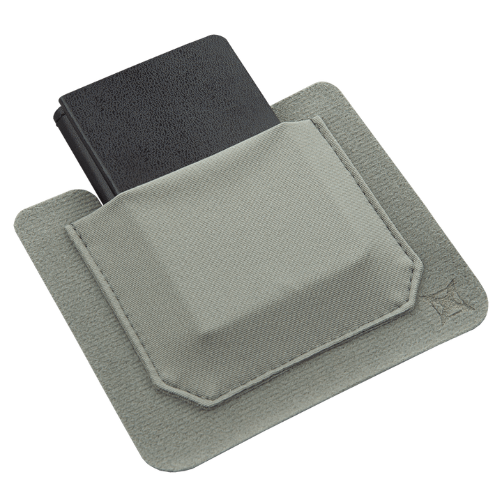 The Vertx Stretch Pocket Small 2 pack includes a black rectangular item fitted in a light grey square fabric pouch with an open top. The Tactigami pouches, made by Vertx, are crafted from durable material and feature stitched borders. The overall design is minimalistic and functional, making them perfect for kit organization.