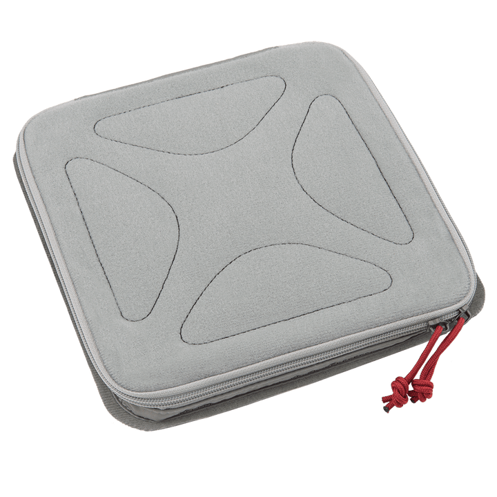 A square gray zippered carrying case with rounded corners and a textured pattern on the top, perfect for the Vertx Pack Organizer Medium. The zipper pull has a red cord attached, blending seamlessly into the Tactigami™ system from Vertx.