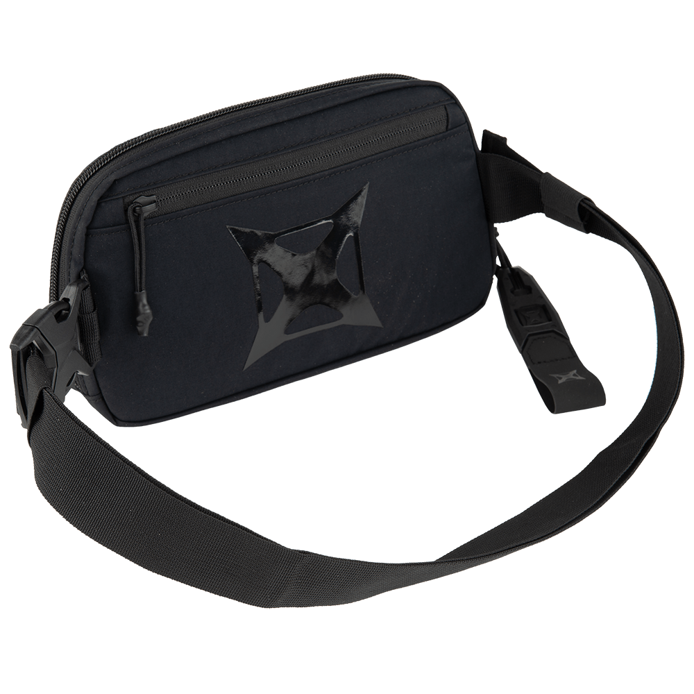 The Vertx Everyday Fanny Pack 2.0 by Vertx is a black crossbody bag featuring a zippered main compartment, a wide adjustable strap, and a stylish star-shaped design—perfect for hands-free carry with both style and function.