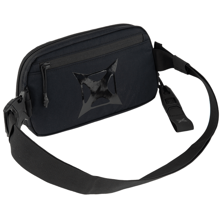 The Vertx Everyday Fanny Pack 2.0 by Vertx is a black crossbody bag featuring a zippered main compartment, a wide adjustable strap, and a stylish star-shaped design—perfect for hands-free carry with both style and function.