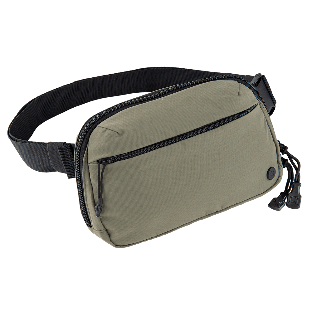 The Vertx Everyday Fanny Pack by Vertx is a khaki-colored bag featuring a front zipper pocket, a main compartment with two zipper pulls, and a black adjustable strap. It has a small black logo on the bottom right corner of the front pocket, making it an ideal choice for concealed carry enthusiasts inspired by Lena Miculek.