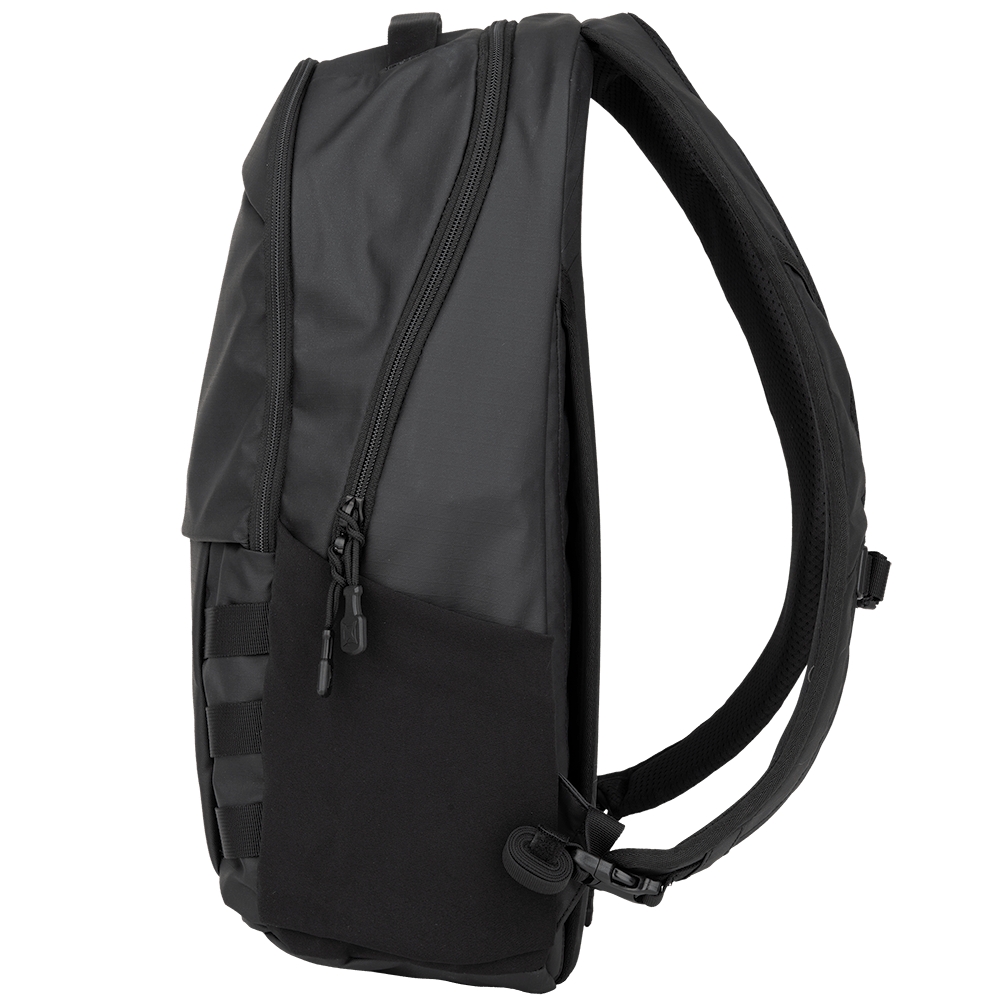 The Vertx Urban Ghost Pack is a sleek black backpack showcased from a side angle, featuring a modern design with a zippered main compartment, adjustable shoulder straps, and MOLLE webbing for attaching gear. Crafted by Vertx with durable ripstop fabric, it boasts a matte finish that adds an urban edge.