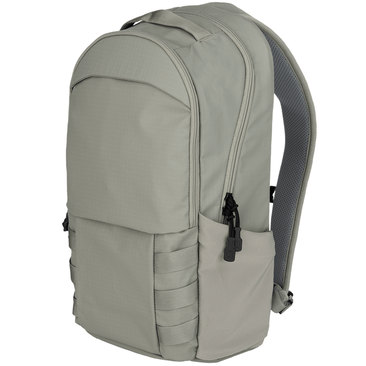 The Vertx Urban Ghost Pack from Vertx showcases a light gray design crafted from durable ripstop fabric. It includes multiple compartments and side pockets, along with black zipper pulls and padded straps for comfort. This pack perfectly balances style and functionality.