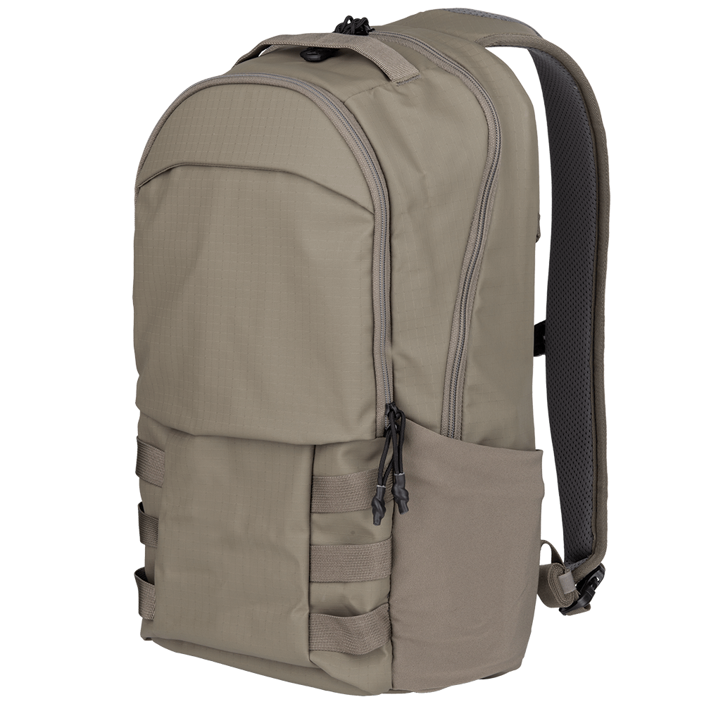 The Vertx Urban Ghost Pack is a tan backpack with a sleek design, crafted from durable ripstop fabric. It features multiple zippered compartments and padded shoulder straps, along with two side pockets, adjustable loops on the front, and a top handle for easy carrying.