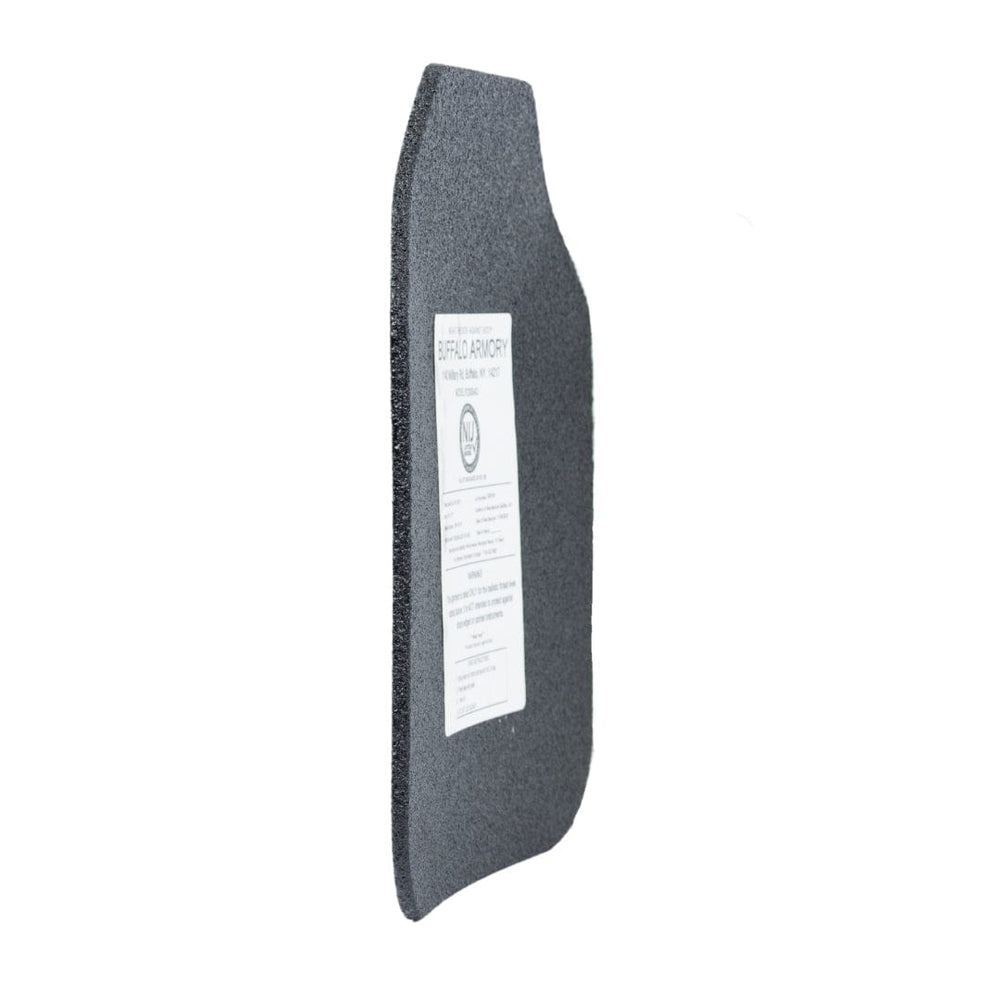 A Buffalo Armory STAR Multi-Curve Level III+ Plate by Premier Body Armor stands upright at an angle with a white information label on its dark gray surface, set against a plain white background to emphasize this ballistic protection item.