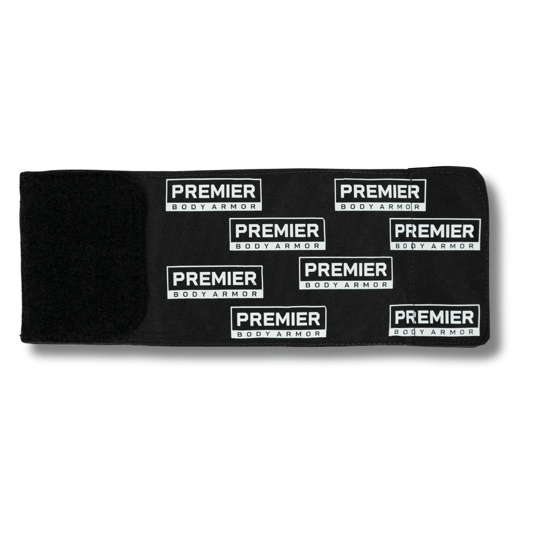 A black fabric strap with a Velcro section on the left, covered in white-and-black "Premier Body Armor" logo patches—a perfect fit for your Premier Body Armor Bulletproof Can Cooler - Limited Edition.