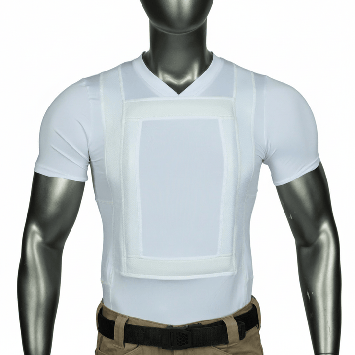 A mannequin wears the Premier Body Armor Everyday Armor T-shirt 360 Core, a white, short-sleeve V-neck with a rectangular chest panel for concealed body armor, tucked into tan pants and accessorized with a black belt.