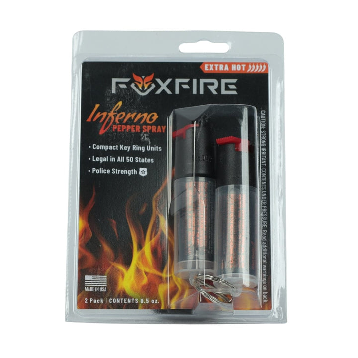 The Fox Labs FoxFire Inferno Twin Pack includes two extra-hot, police-strength keychain pepper sprays, legal in all 50 states. The packaging displays flame graphics along with product details.