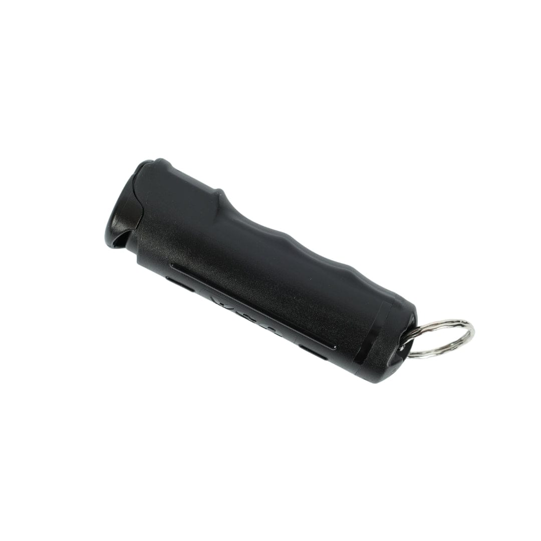The Fox Labs Personal Pocket Unit by Fox Labs is a small black handheld canister with finger grooves and a metal keyring at one end, shown on a white background as a keychain pepper spray.