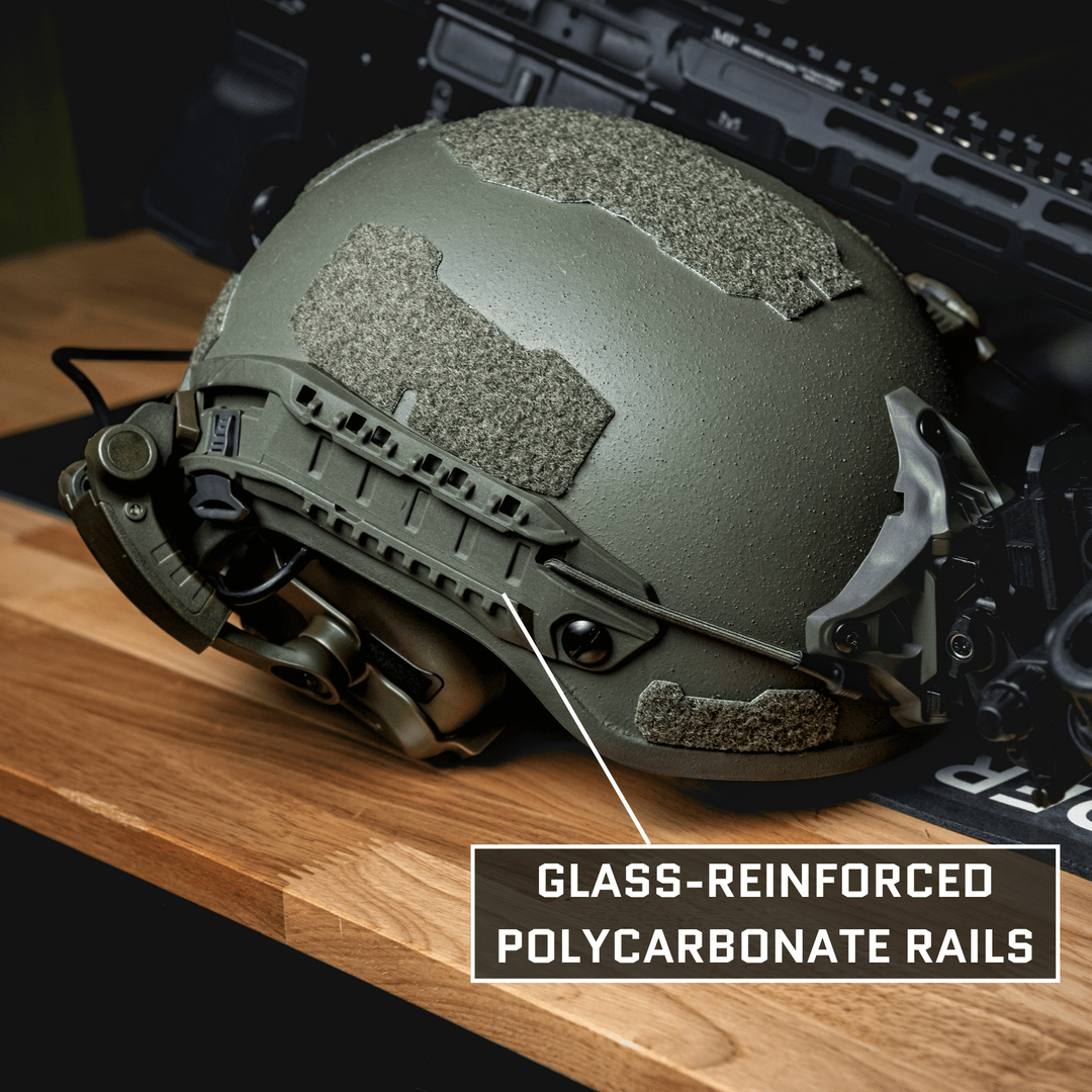 The Premier Body Armor Fortis Ballistic Helmet, featuring advanced ballistic fibers and glass-reinforced polycarbonate rails, sits on a wooden surface with tactical gear in the background.