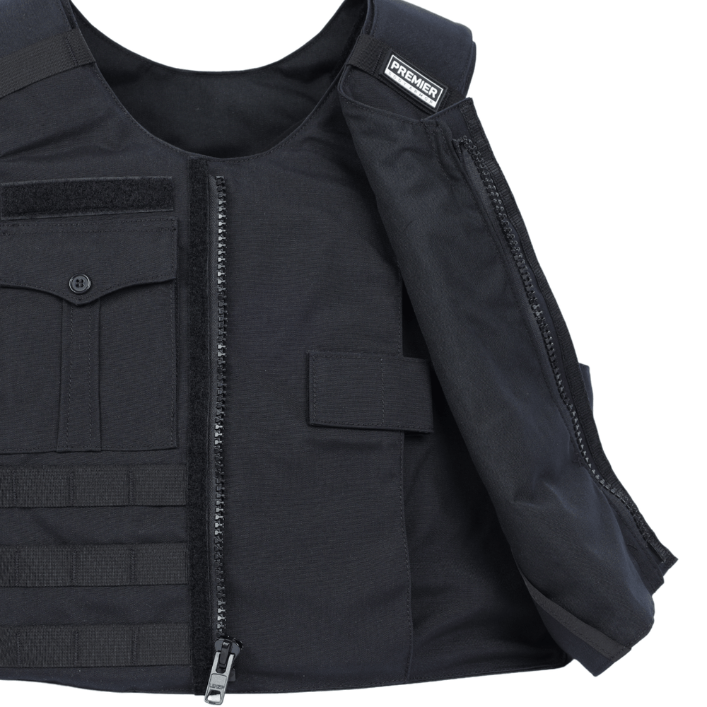 A close-up of the Premier Body Armor Patrol Bravo, a black Level IIIA soft armor patrol vest with a partially open front zipper, front pockets, and a "PREMIER" label on the shoulder, made from heavy-duty fabric.