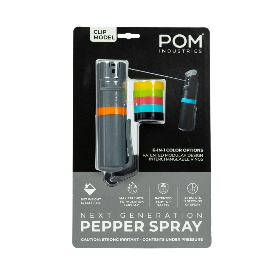The POM Clip Pepper Spray by POM features a gray canister, orange clip, five interchangeable color rings, 14% max strength, and delivers 25 bursts per compact canister—ideal as an EDC self-defense tool.