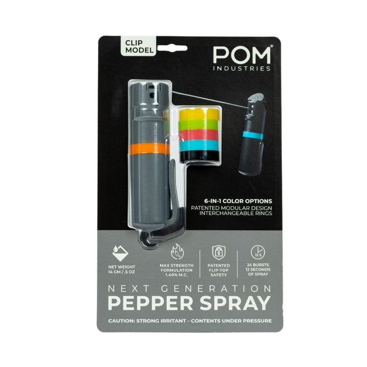 The POM Clip Pepper Spray by POM features a gray canister, orange clip, five interchangeable color rings, 14% max strength, and delivers 25 bursts per compact canister—ideal as an EDC self-defense tool.