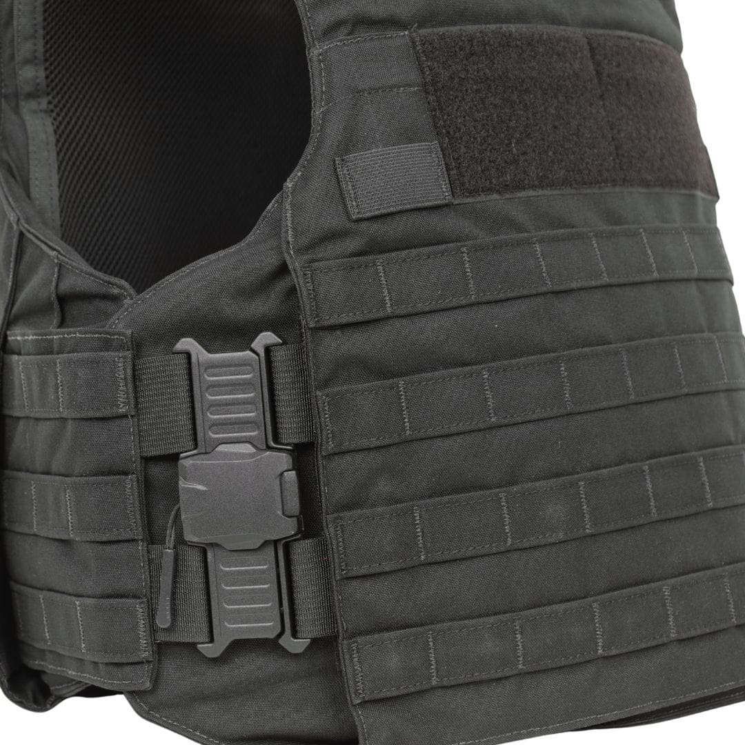 Close-up of the Premier Body Armor Rapid Duty Vest in black, featuring adjustable straps, a quick-release buckle, horizontal webbing for gear attachment, and a Velcro patch area near the shoulder.