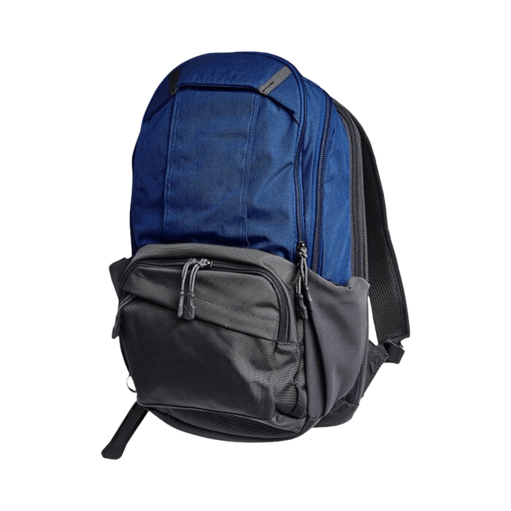 The Vertx Ready Pack 3.0 backpack, in a striking blue and black color scheme, boasts multiple zippered compartments and adjustable shoulder straps. The front pocket is a contrasting black, while the rest of the bag is a vibrant blue. It features a CCW compartment and is shown standing upright against a plain white background.