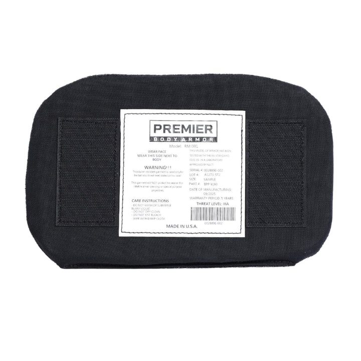 Black body armor panel with a visible label on a white background