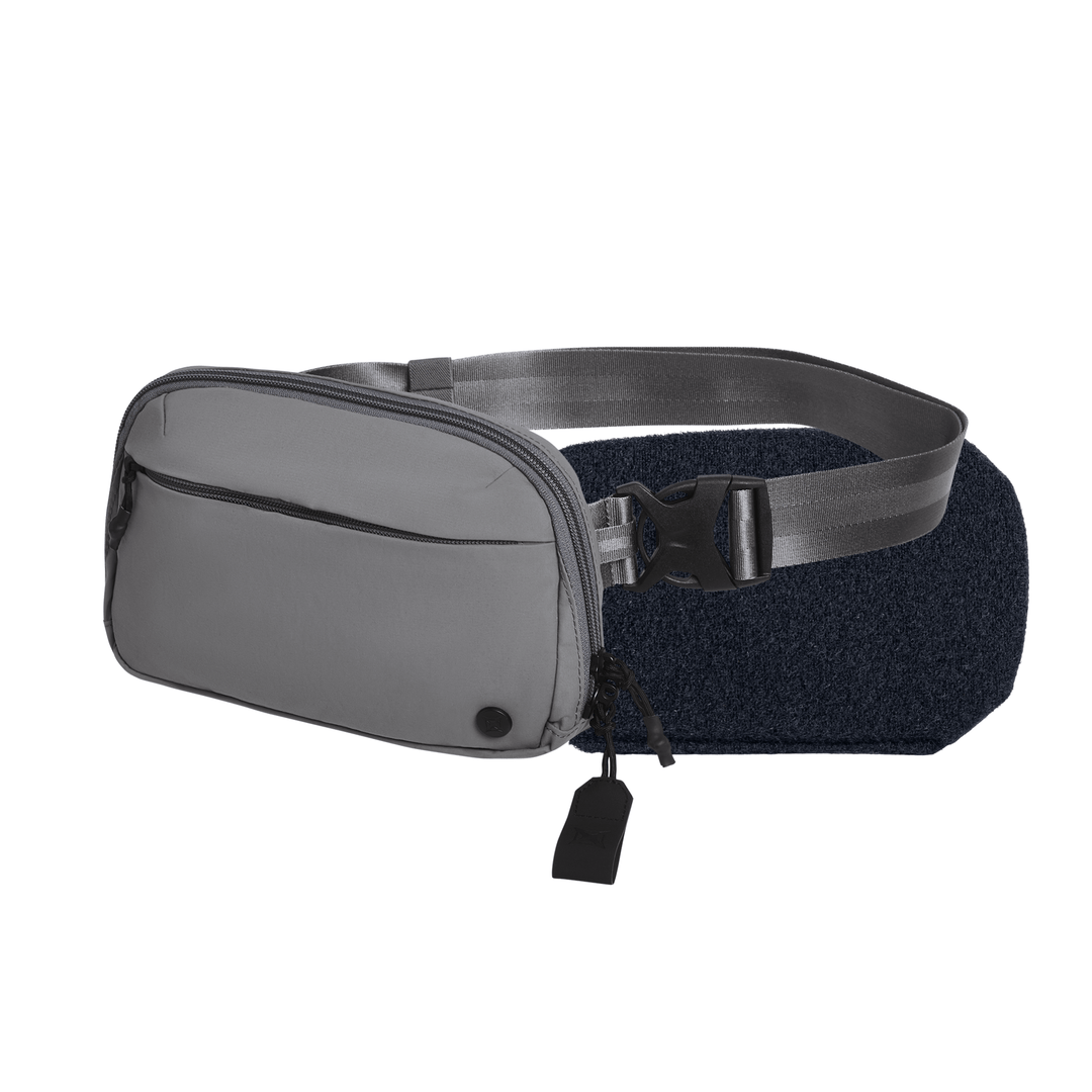 The Armored Vertx Everyday Fanny Pack 2.1 Bundle by Vertx/Premier is a gray CCW pack with a front zipper pocket, main compartment, and adjustable strap with black buckle, shown on a plain white background—perfect for everyday carry.
