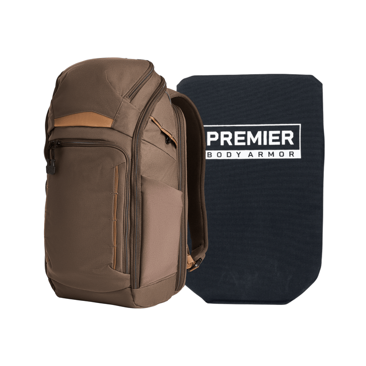 A brown and tan Armored Vertx Gamut 22L Pack Bundle by Vertx/Premier sits beside a rectangular black Premier Body Armor soft panel labeled in white.