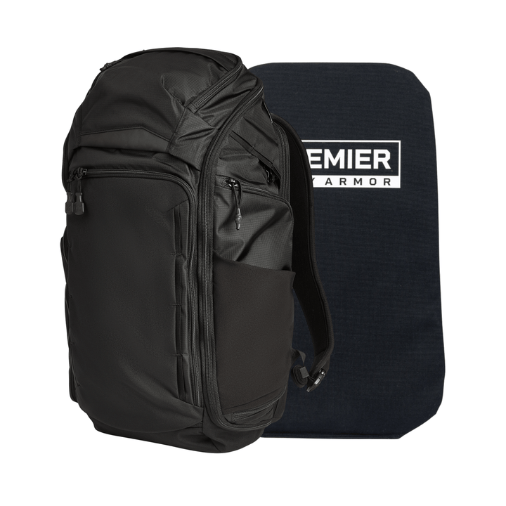 A Vertx/Premier Armored Gamut 32L Pack stands upright beside a rectangular dark blue Premier Armor Level IIIA ballistic panel, which is slightly taller than the backpack.