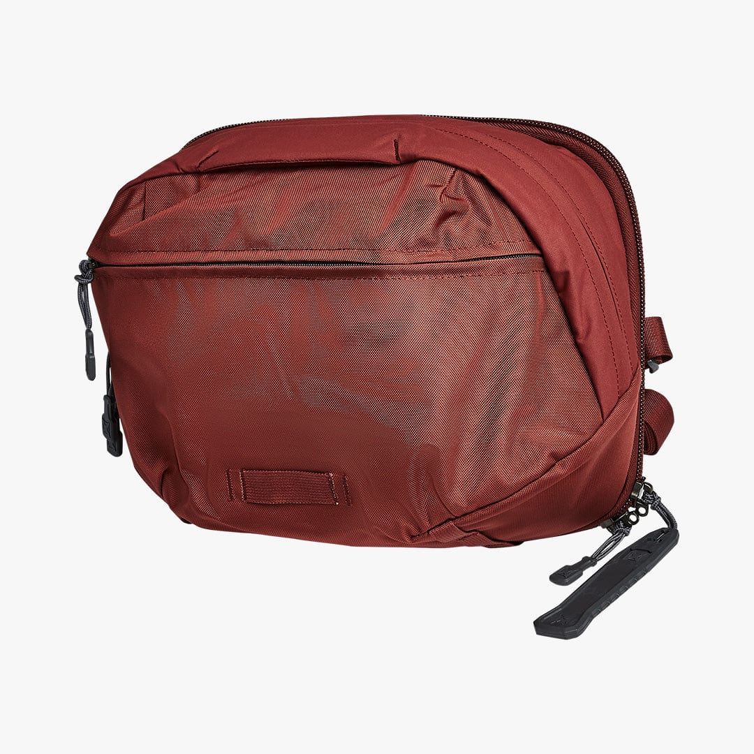 Image of Vertx Navigator Sling in Red. The perfect travel bag for EDC gear. Add backpack body armor to the Vertx Navigator. 